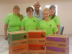 Photo: Philip DeBerard donates Girl Scout cookies to Real Life Children’s Ranch from Troop 60497