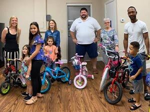 Giving away bikes at the Okeechobee Health and Safety Expo. We had some excited kids!